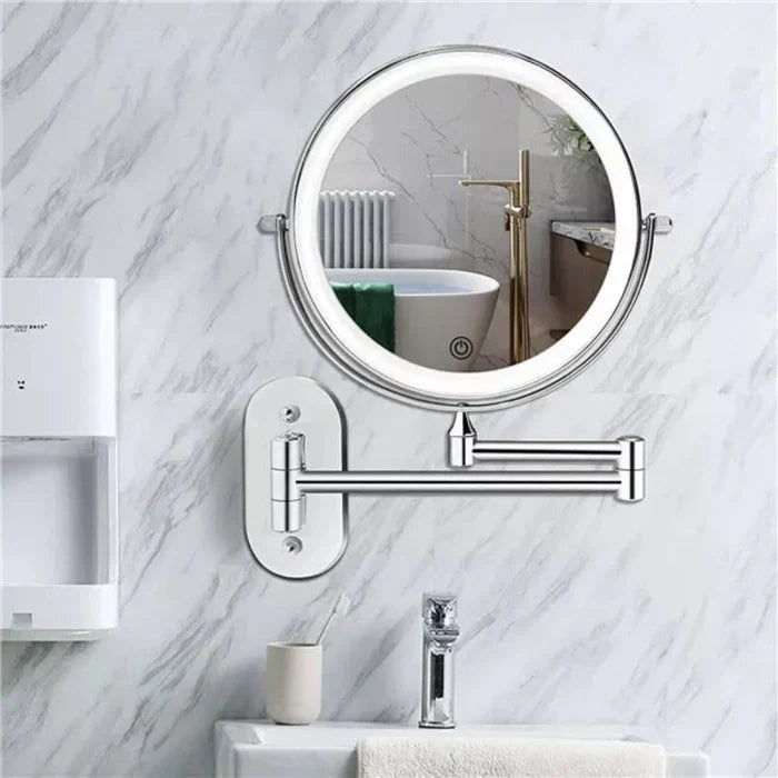 Silver LED magnifying wall mirror with an extending arm in a bathroom