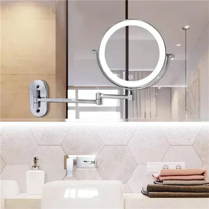 Silver LED magnifying wall mirror above a bathroom basin