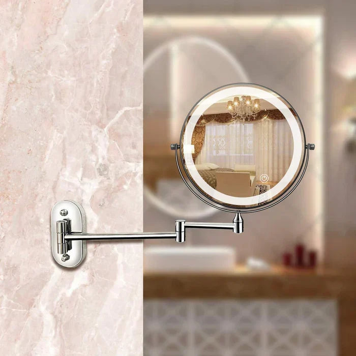 Silver LED magnifying wall mirror mounted beside a vanity