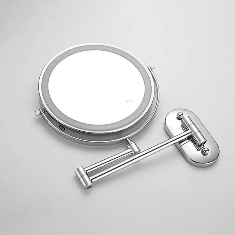 Silver LED magnifying wall mirror showing its swivel mounting arm