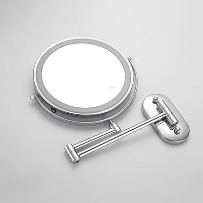 Silver LED magnifying wall mirror showing its swivel mounting arm