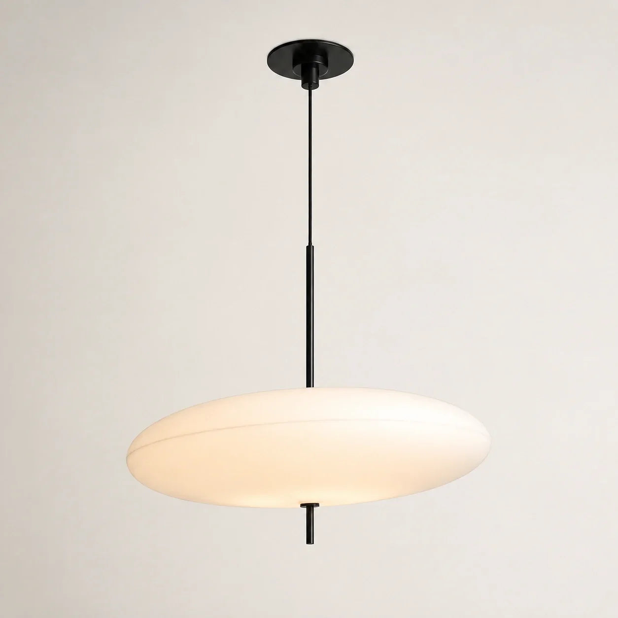 Modern LED pendant light featuring a sleek flying saucer design with a white acrylic shade and a minimalist black stem, ideal for contemporary rooms.