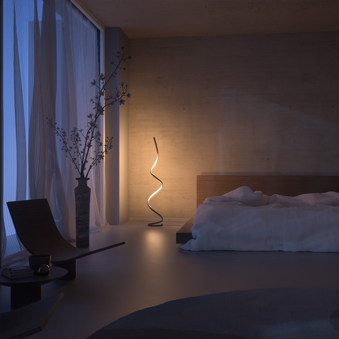 Black spiral floor lamp casting warm light in a bedroom