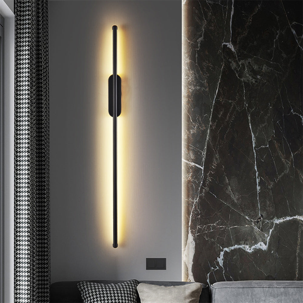 Black linear LED wall light on a marble feature wall