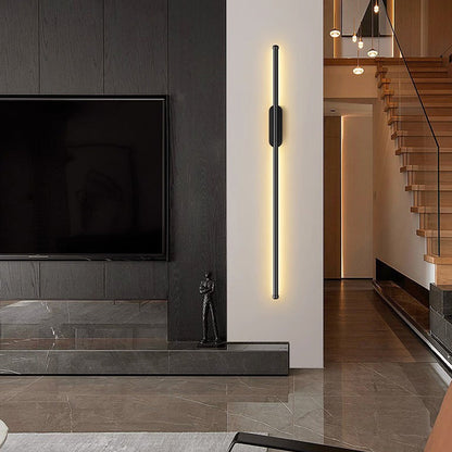 Long LED accent wall light beside a television
