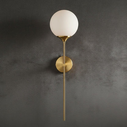Opal white globe wall light with brass stem