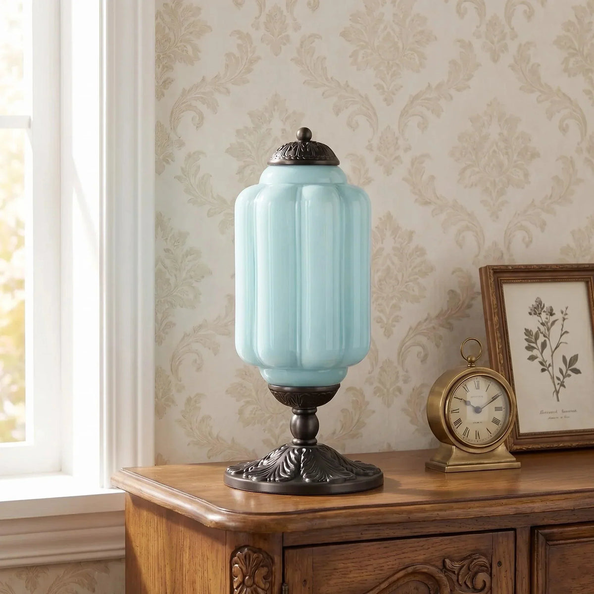 Blue glass table lamp with black base