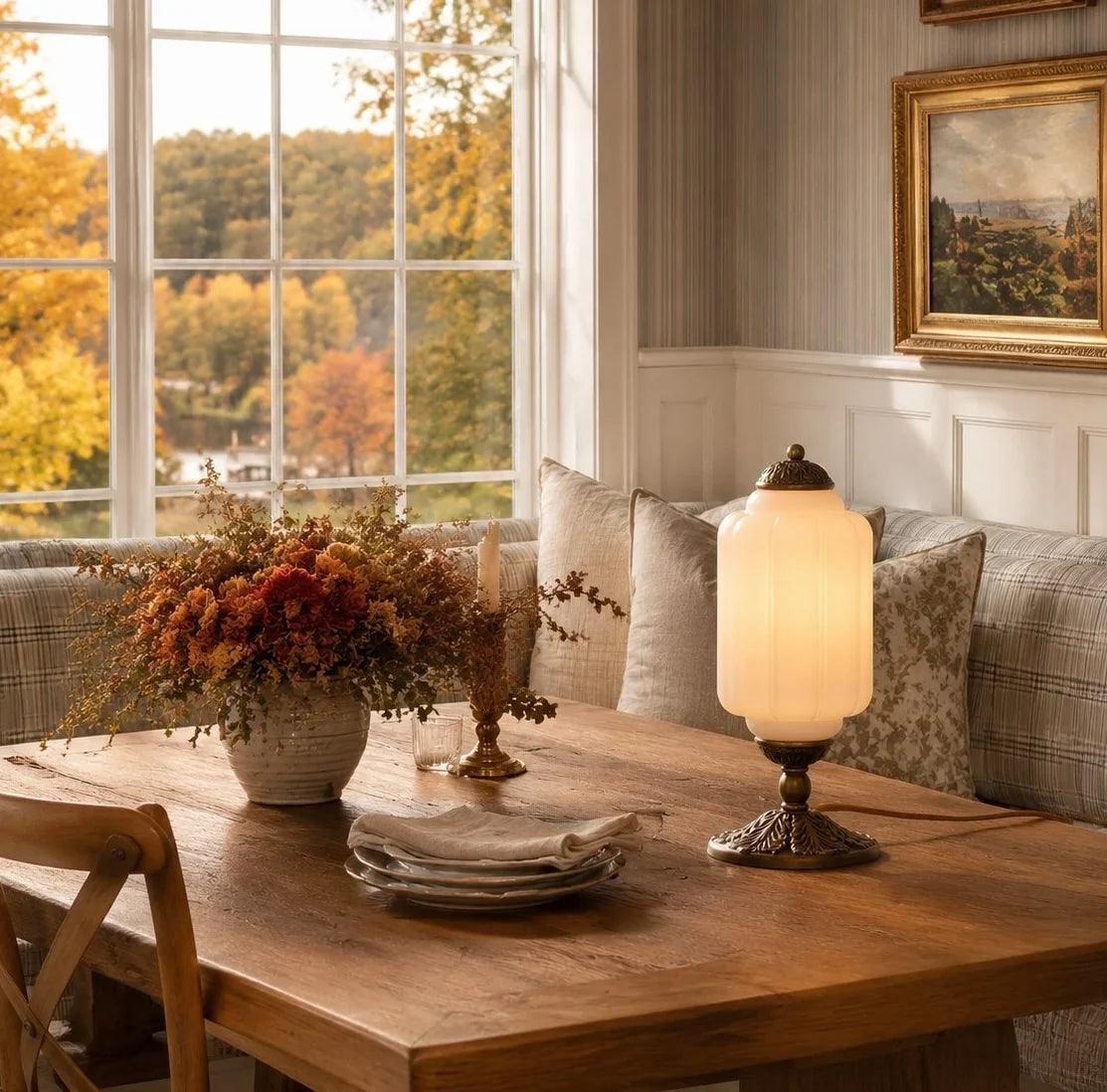 Glowing retro glass table lamp on a dining table