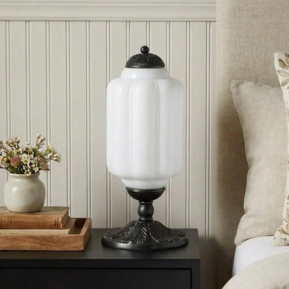 White ribbed glass table lamp with black base