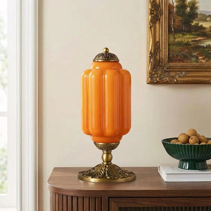 Orange ribbed glass table lamp with brass base