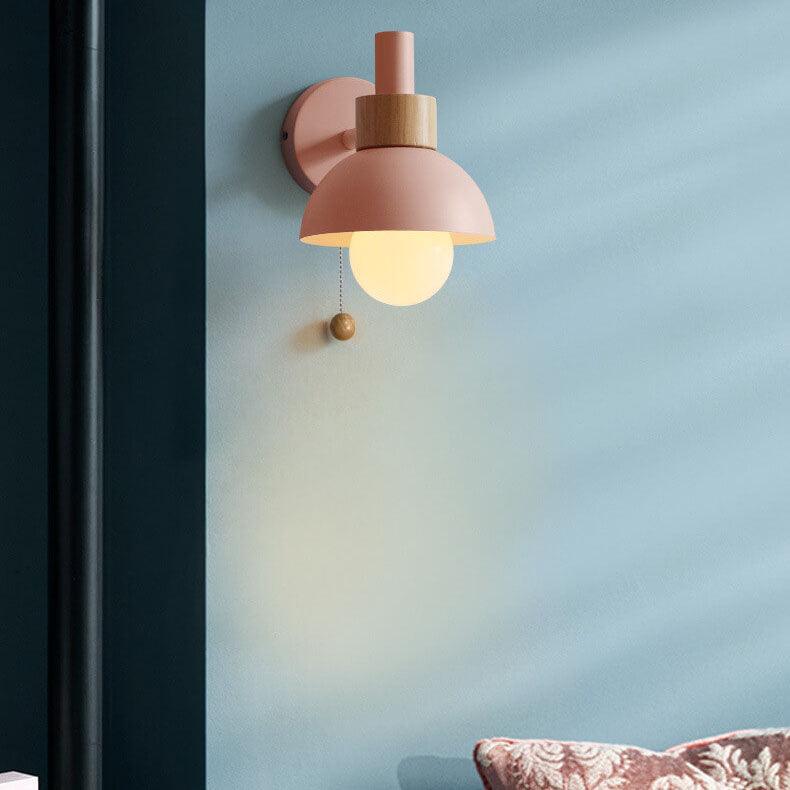 Pink Macaron wall light on a blue wall