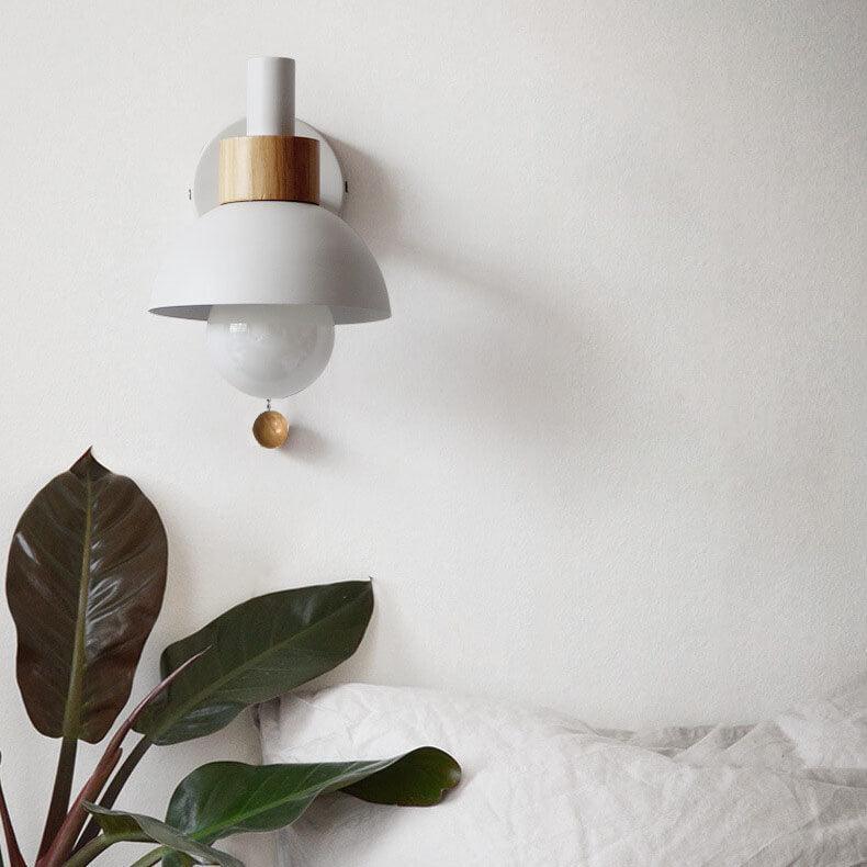 White Macaron wall light above a bed