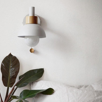 White Macaron wall light above a bed