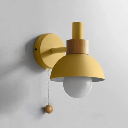 Wheat yellow globe wall sconce close-up