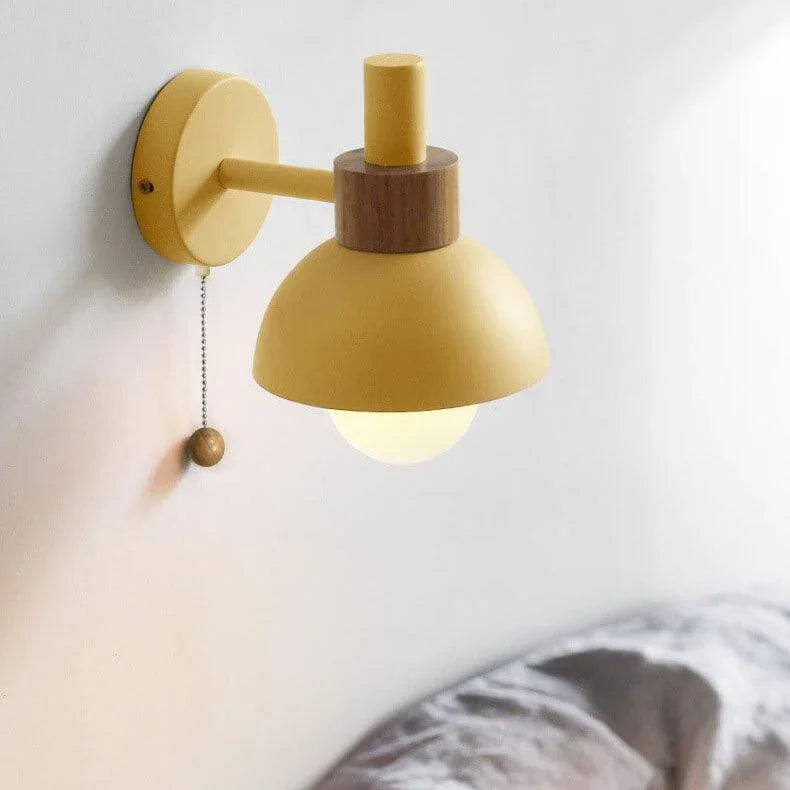 Wheat yellow globe wall light with a pull chain