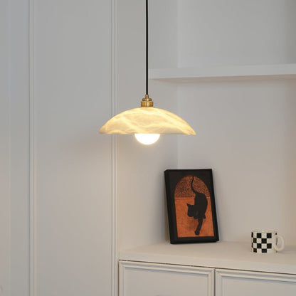 Marble pendant in a room with framed artwork