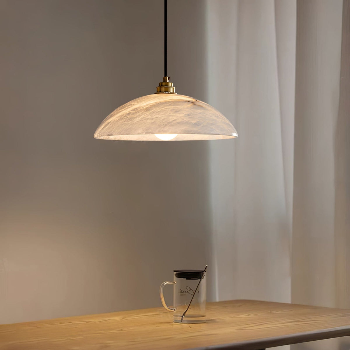 Marble dome pendant above a timber table