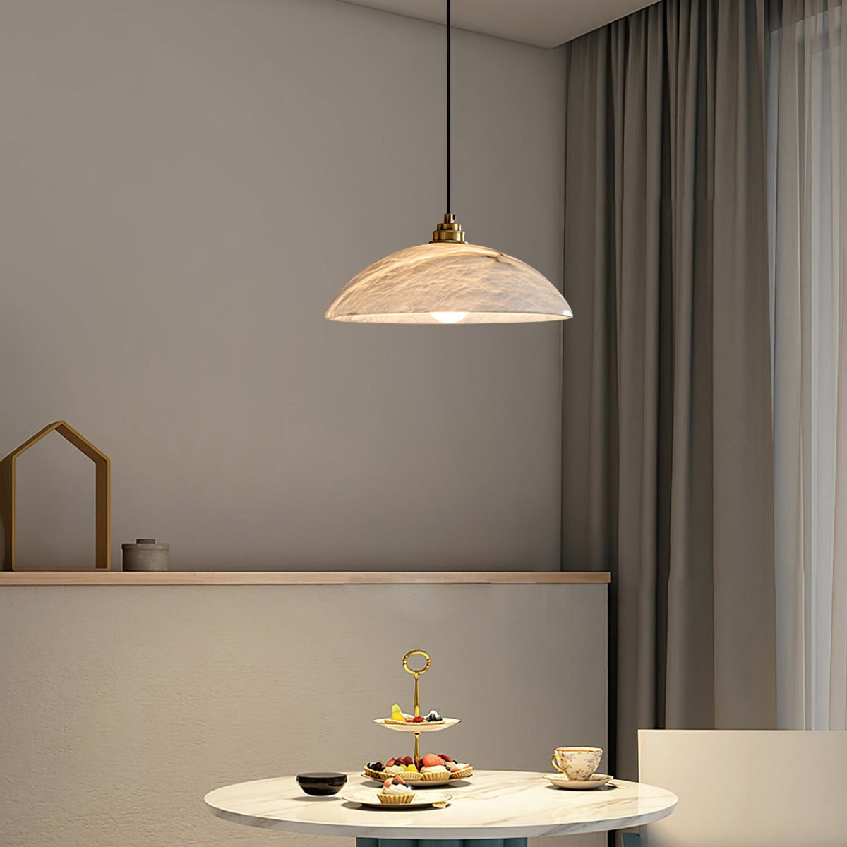 Marble dome pendant above a round dining table