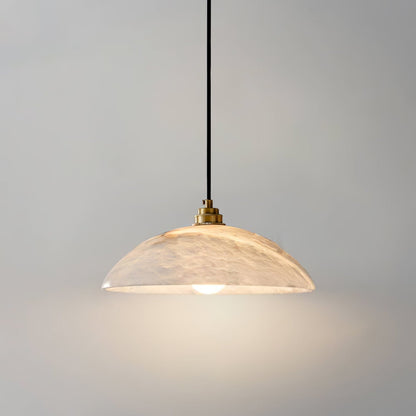 Marble dome pendant against a pale wall
