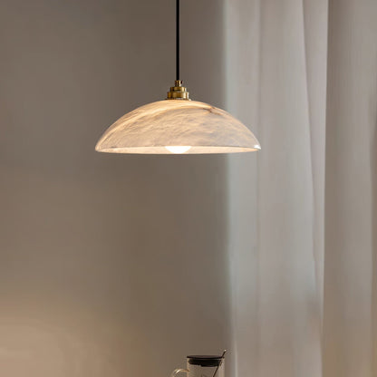 Illuminated marble shade near curtains