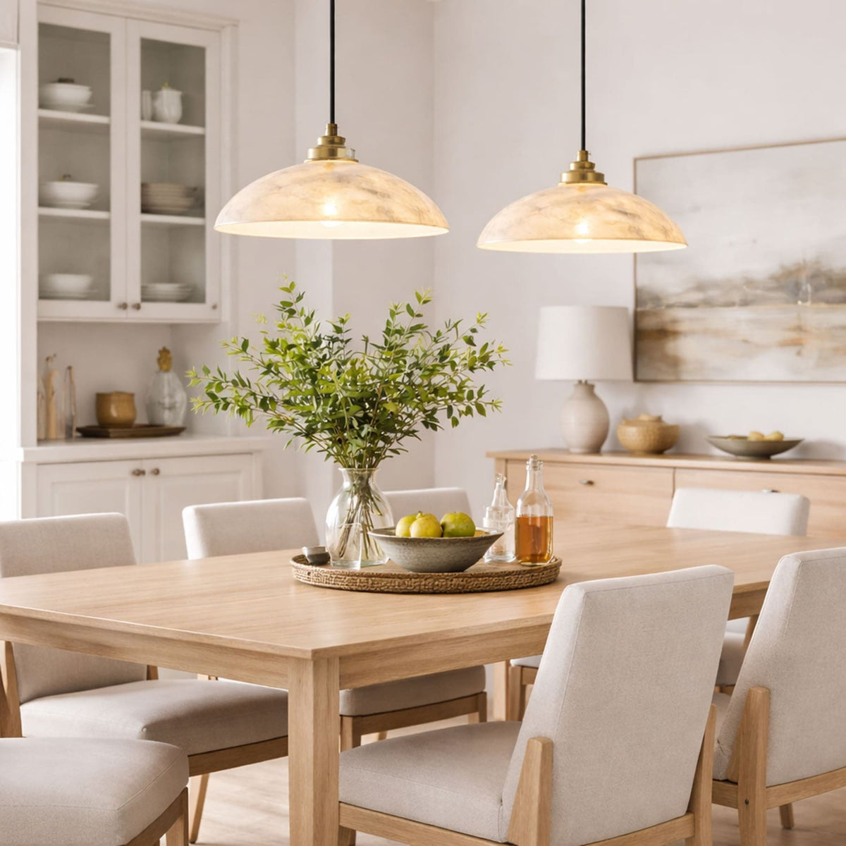 Two marble dome pendants above a dining table