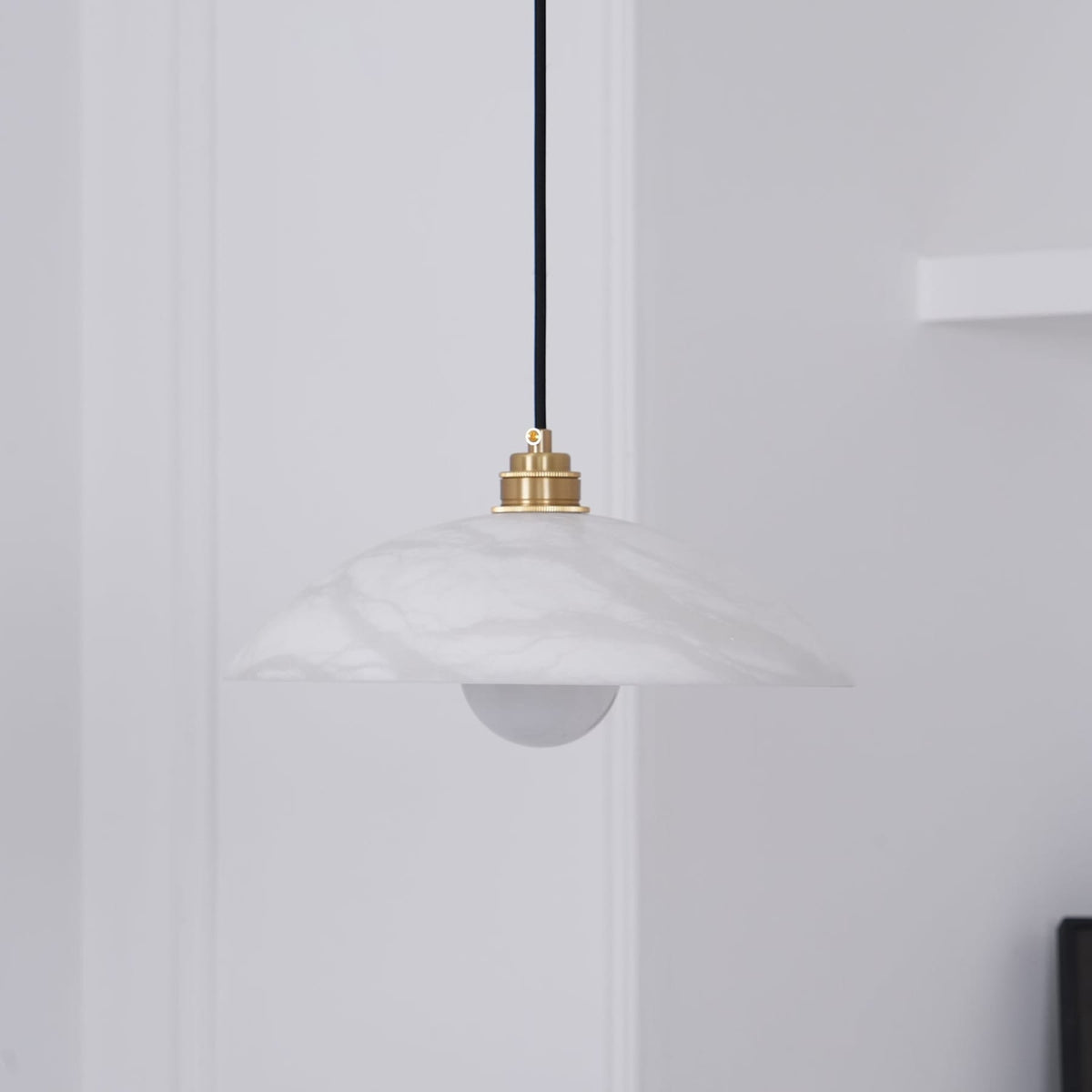 White marble pendant shade viewed close up