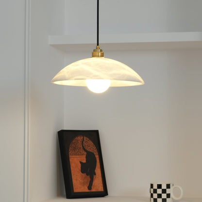 Warmly lit marble pendant near framed artwork