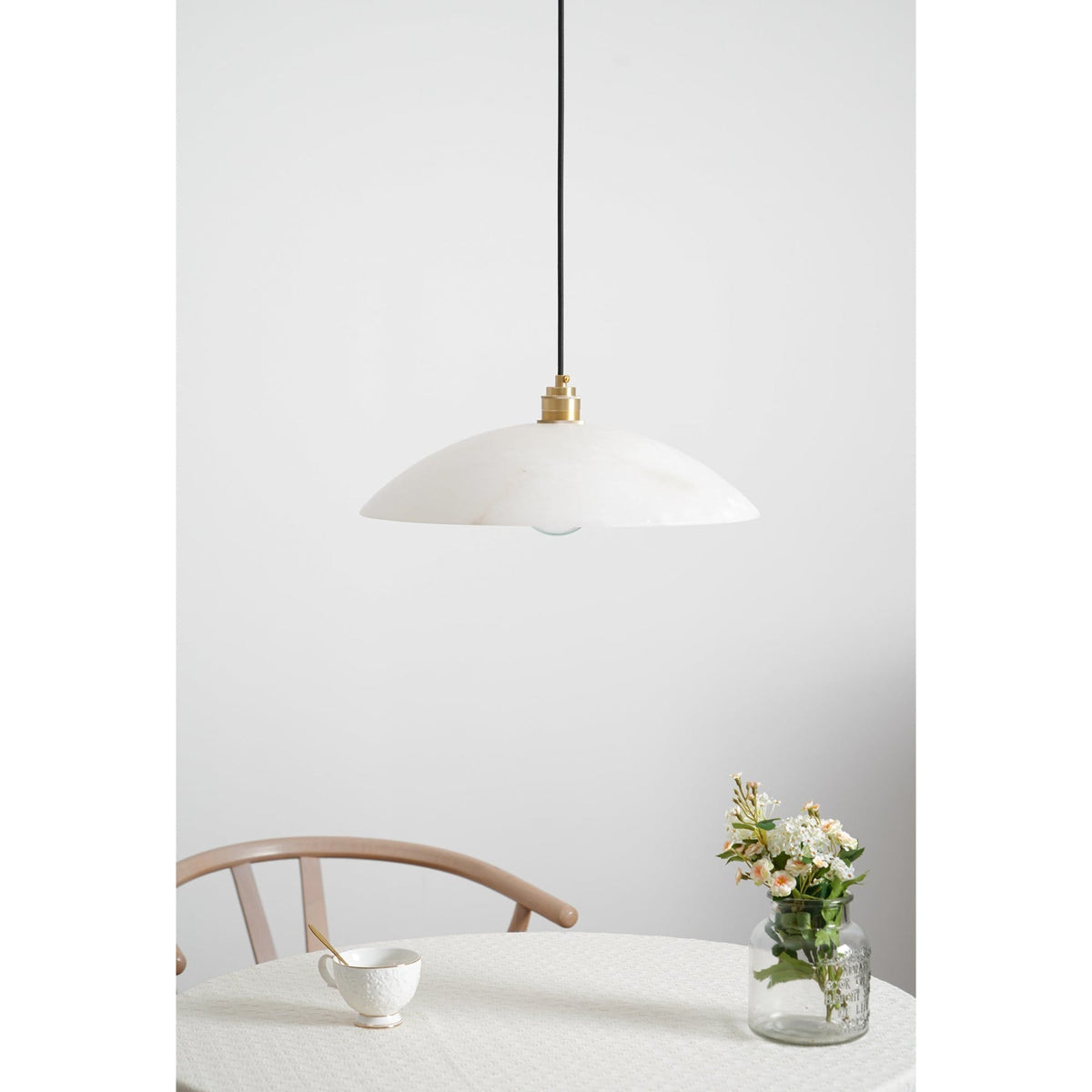 Marble pendant near a table and timber chair