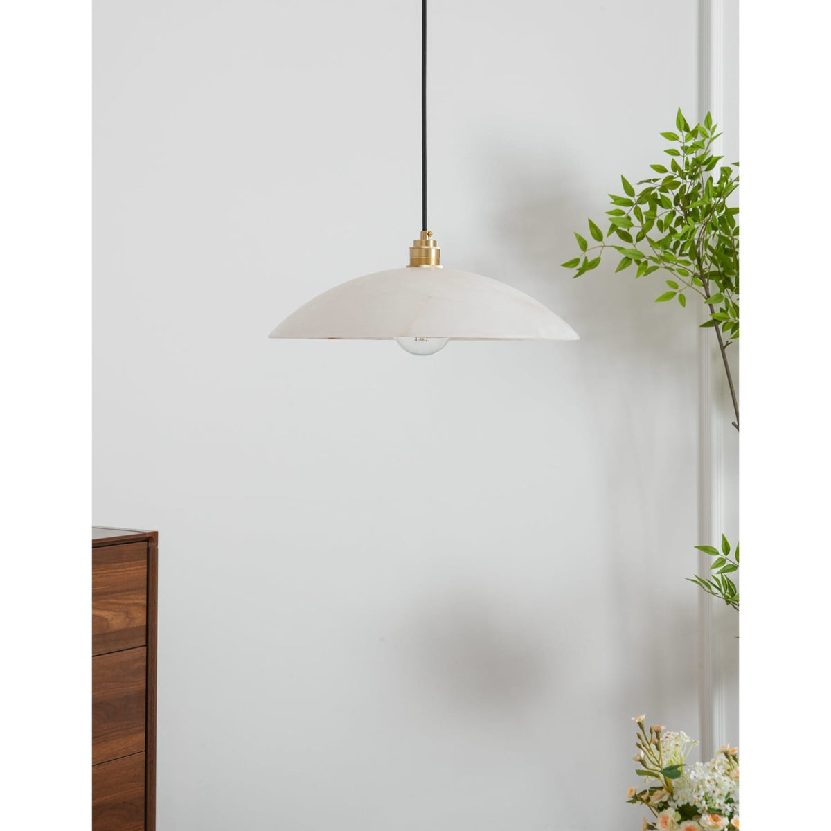 Marble dome pendant near a timber cabinet