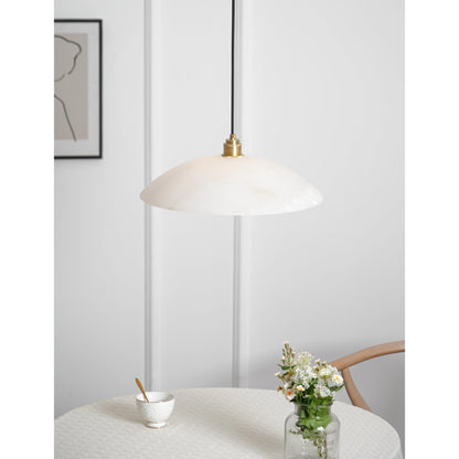 White marble pendant near a table and chairs