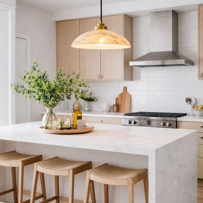 Marble dome pendant above a white kitchen island