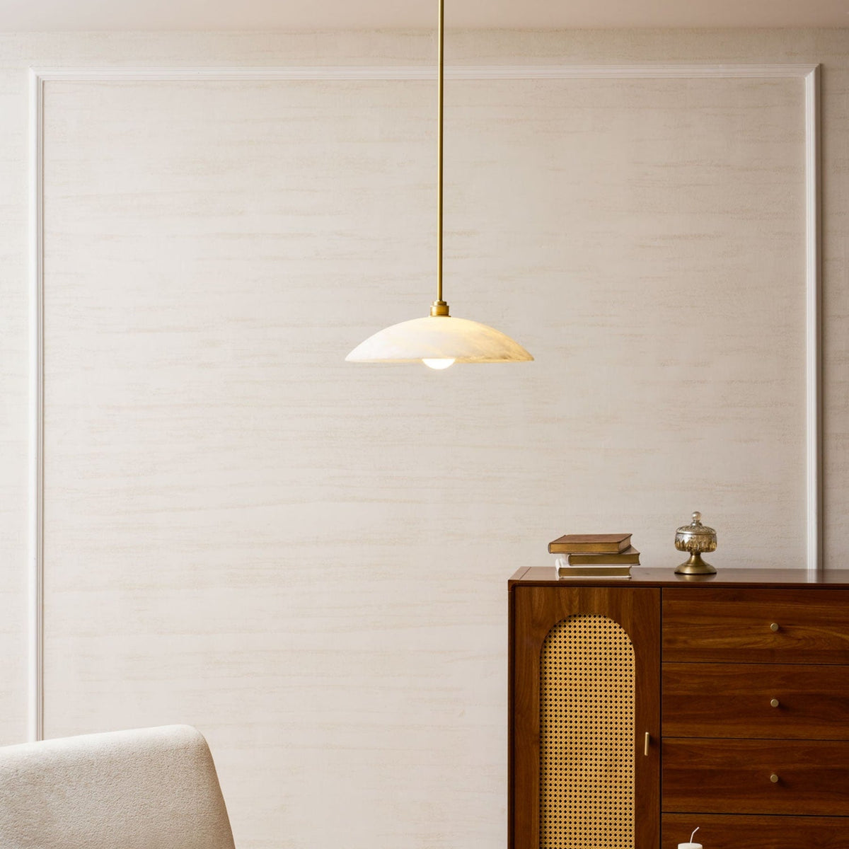 Marble pendant above a timber cabinet