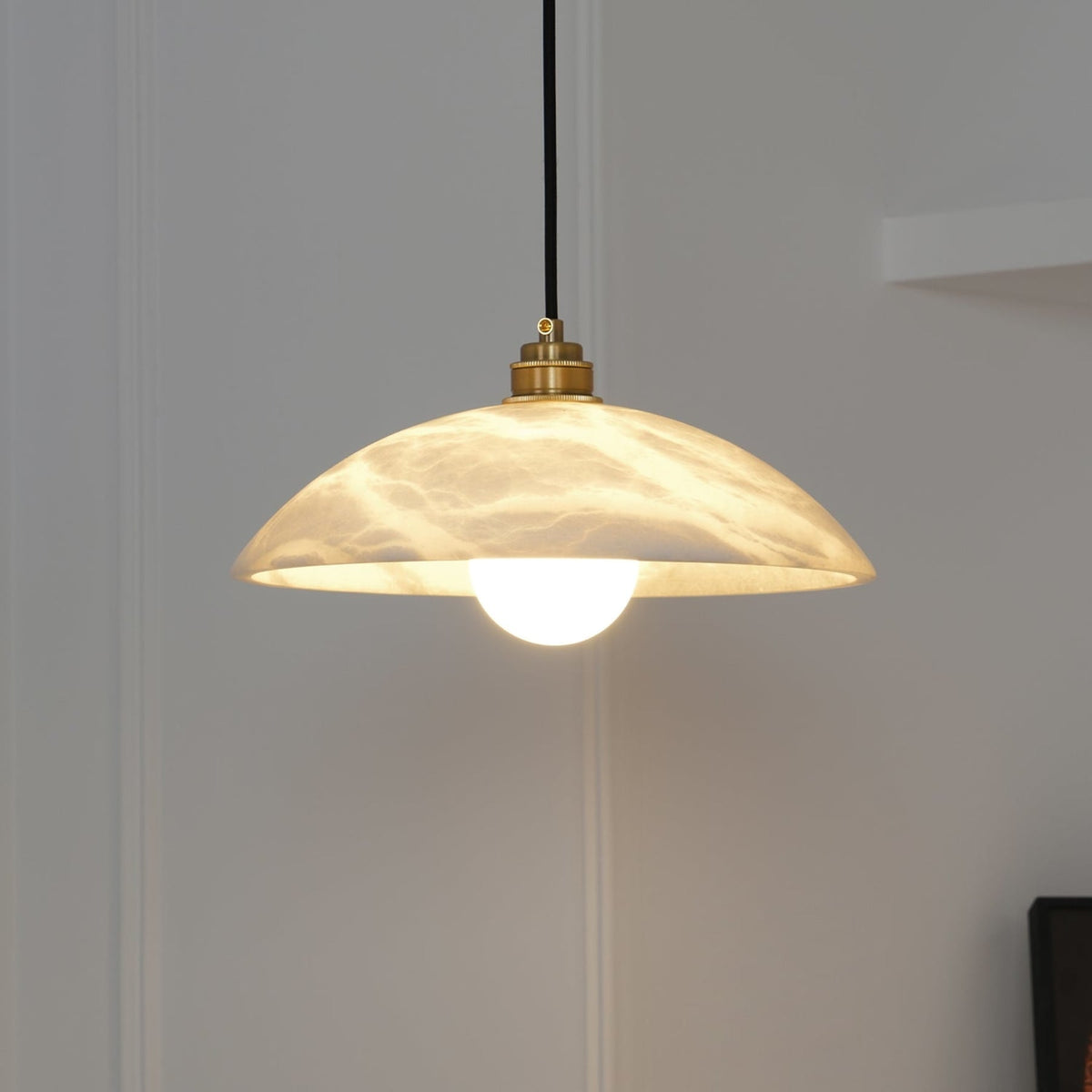 Warm light beneath a marble dome shade