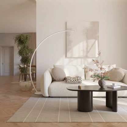 White arc LED floor lamp in a bright living room