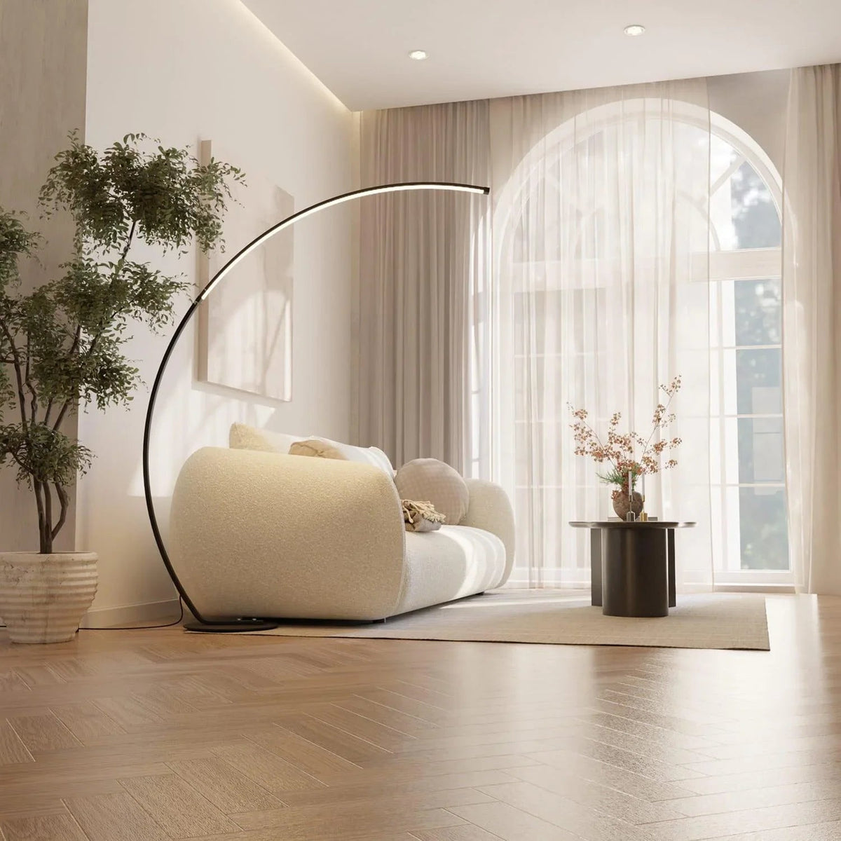 Black arc floor lamp over a cream sofa