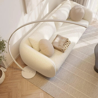 White arc lamp and circular base viewed from above