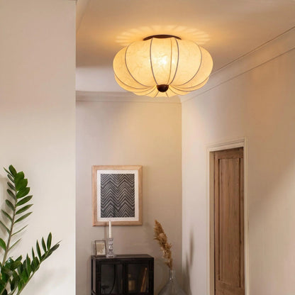 Glowing silk ceiling light in a hallway