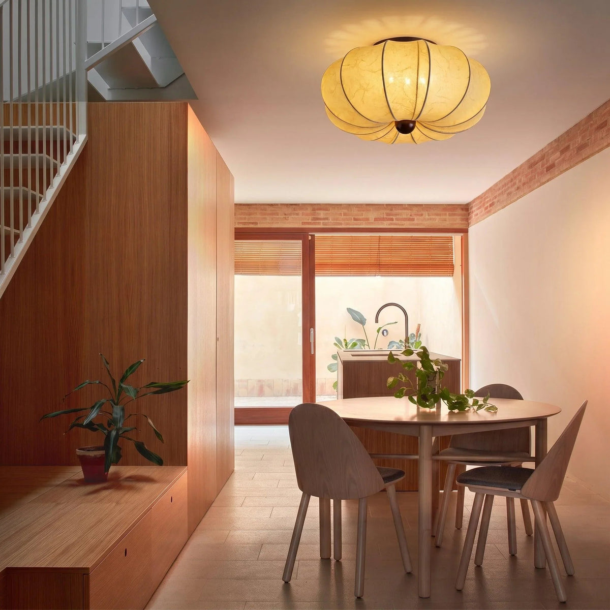 Silk ceiling light above a dining area