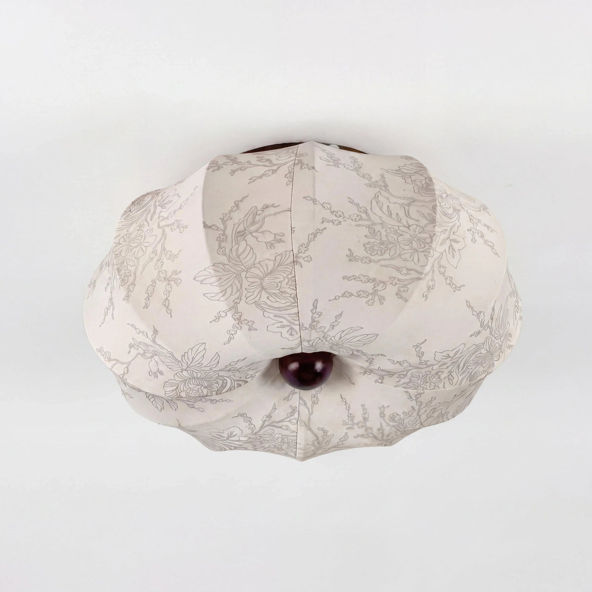Unlit patterned silk ceiling shade viewed from below