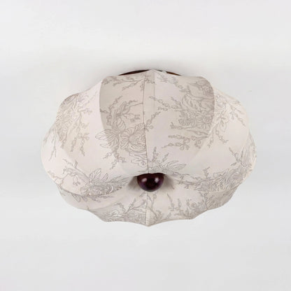 Unlit patterned silk ceiling shade viewed from below