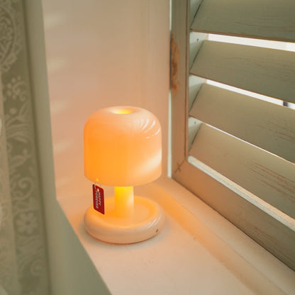 Mini mushroom table lamp with rounded base and warm LED glow 34