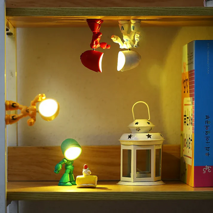 Robot LED table lamps arranged on a shelf