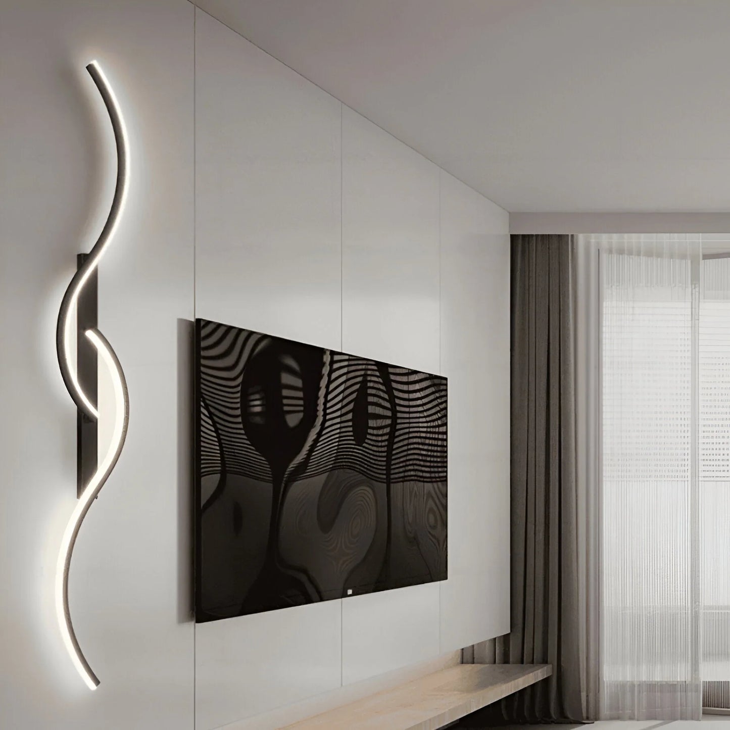A minimalist curved LED wall light with a sleek, serpentine design mounted on a white wall next to a television in a modern living room interior.