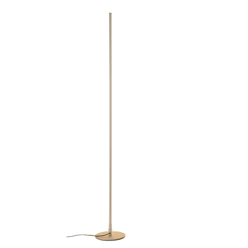 A minimalist LED floor lamp featuring a slim, gold-coloured linear pole on a circular base, designed for modern home decor and interior lighting.