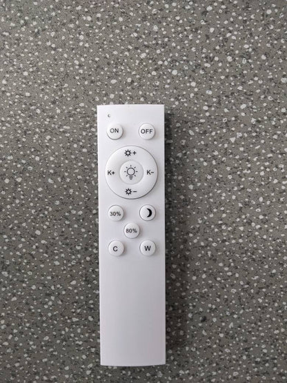 A white remote control for the Minimalist LED Floor Lamp, featuring buttons for power, brightness level, and colour temperature adjustment.