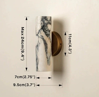 Minimalist cylindrical marble wall lamp featuring a brass base, shown with technical dimension annotations indicating a maximum height of 24cm.