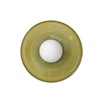 Modern Bauhaus flush mount ceiling light featuring a circular olive green glass shade with a central white globe bulb, viewed from directly below.