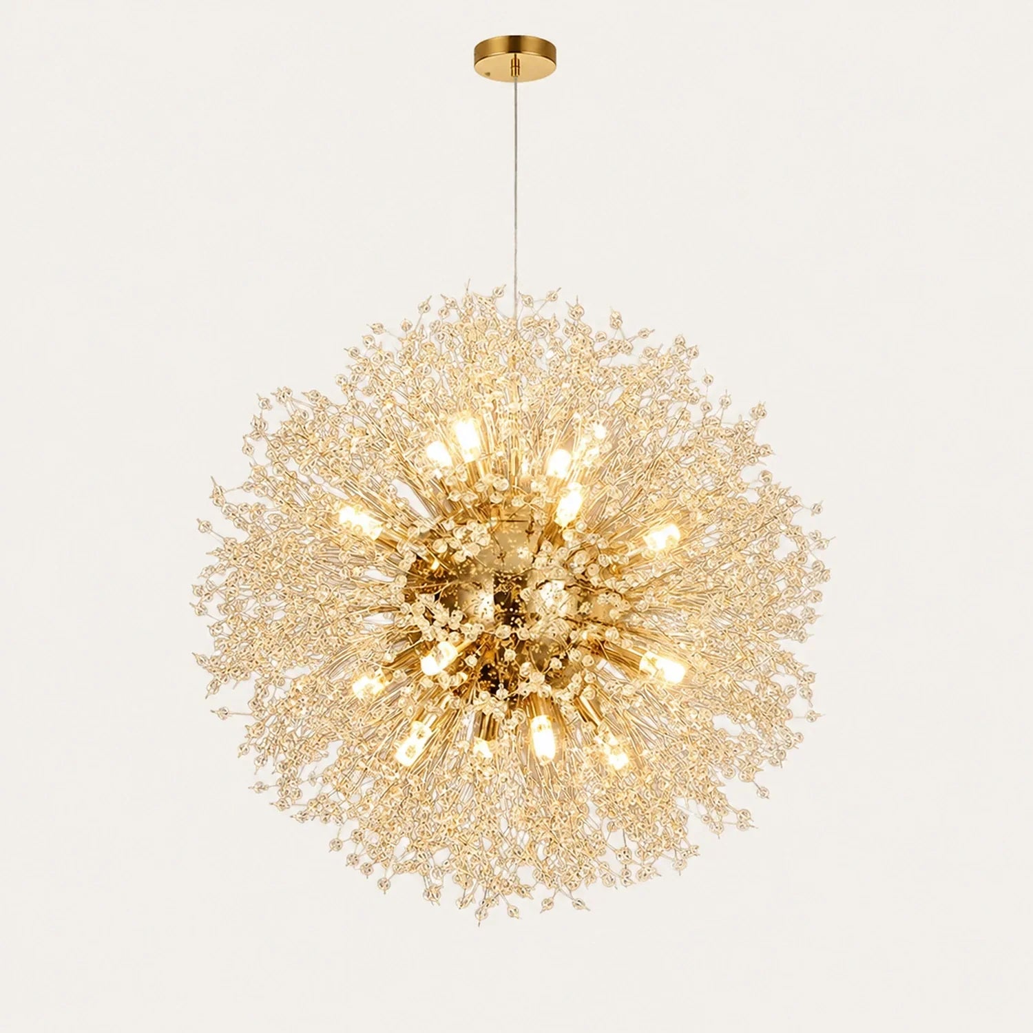 A spherical modern dandelion LED pendant light with a gold finish, featuring delicate radiating branches tipped with glowing lights against a plain backgro