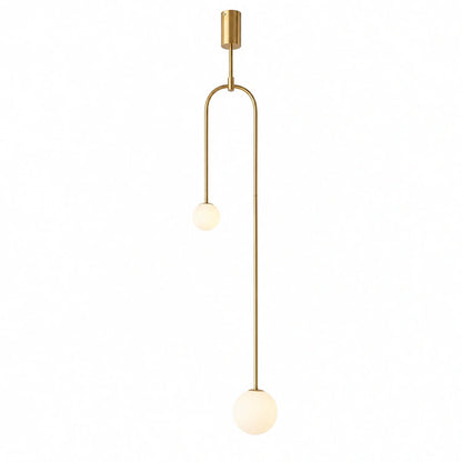 Modern double globe pendant light featuring a sleek gold-tone frame with two offset white glass spheres suspended at different heights for minimalist decor