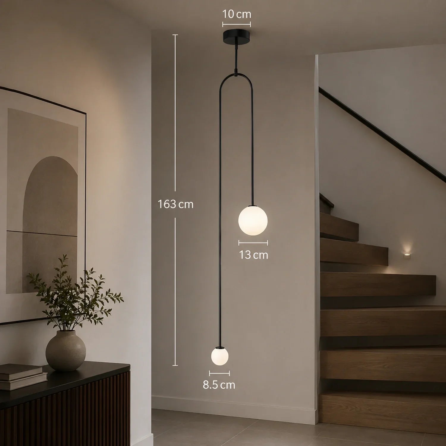 Modern black double globe pendant light with dimensions shown, featuring two spherical glass shades suspended from a minimalist ceiling fixture.